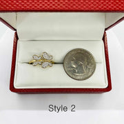 14k Gold butterfly ring in a red jewelry box with a coin next to it for scale
