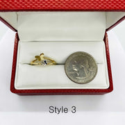 14k Gold butterfly ring in a red jewelry  box with a silver coin for size reference