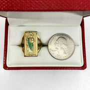 14k Gold ring with San Judas design next to a quarter in a red box.