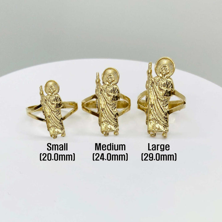 Three 14k gold rings with Saint Jude design of different sizes on a white background
