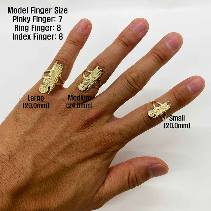 Hand wearing three 14k gold rings with Saint Jude design with size labels on a white background