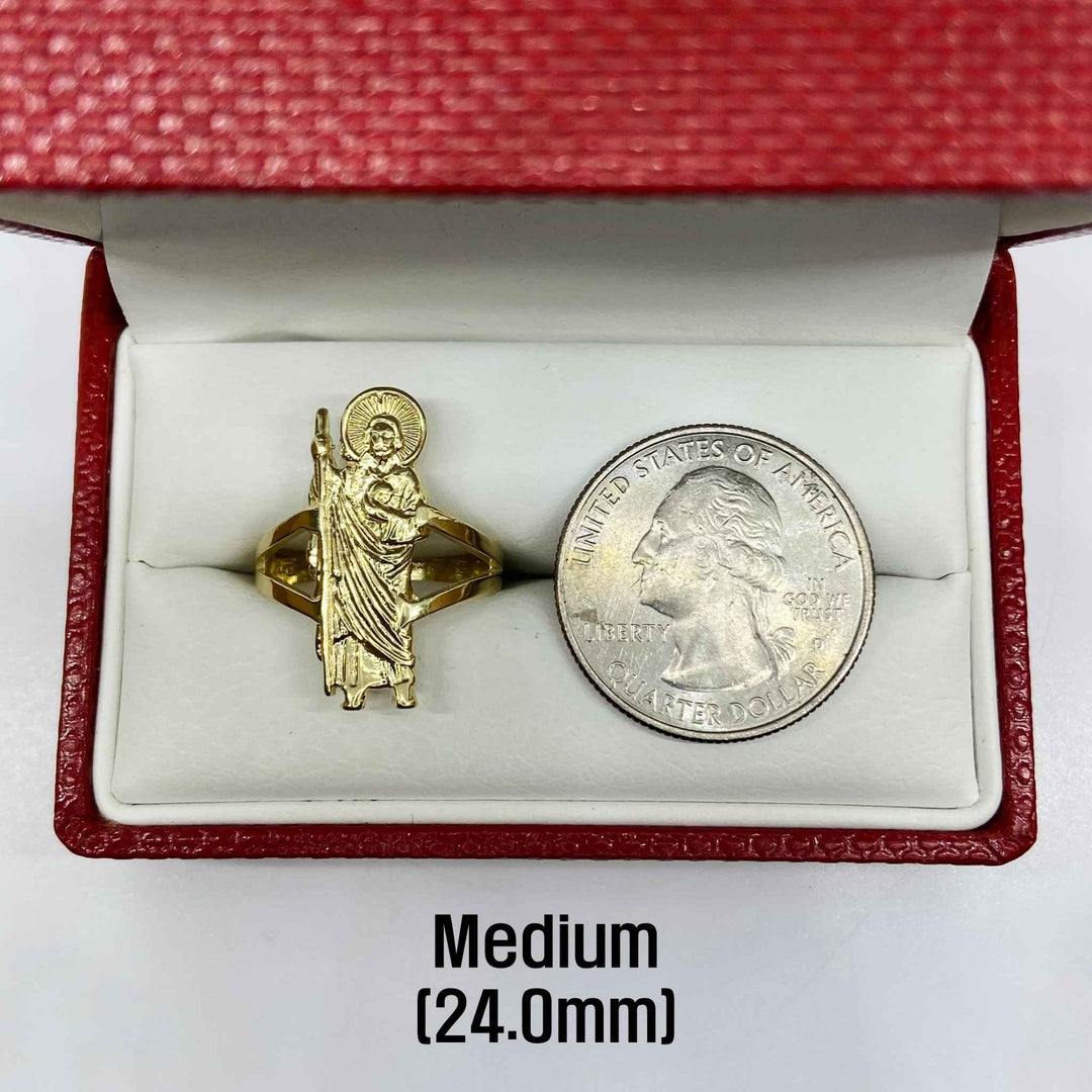 14k Gold ring with Saint Jude design next to a U.S. quarter dollar coin.
