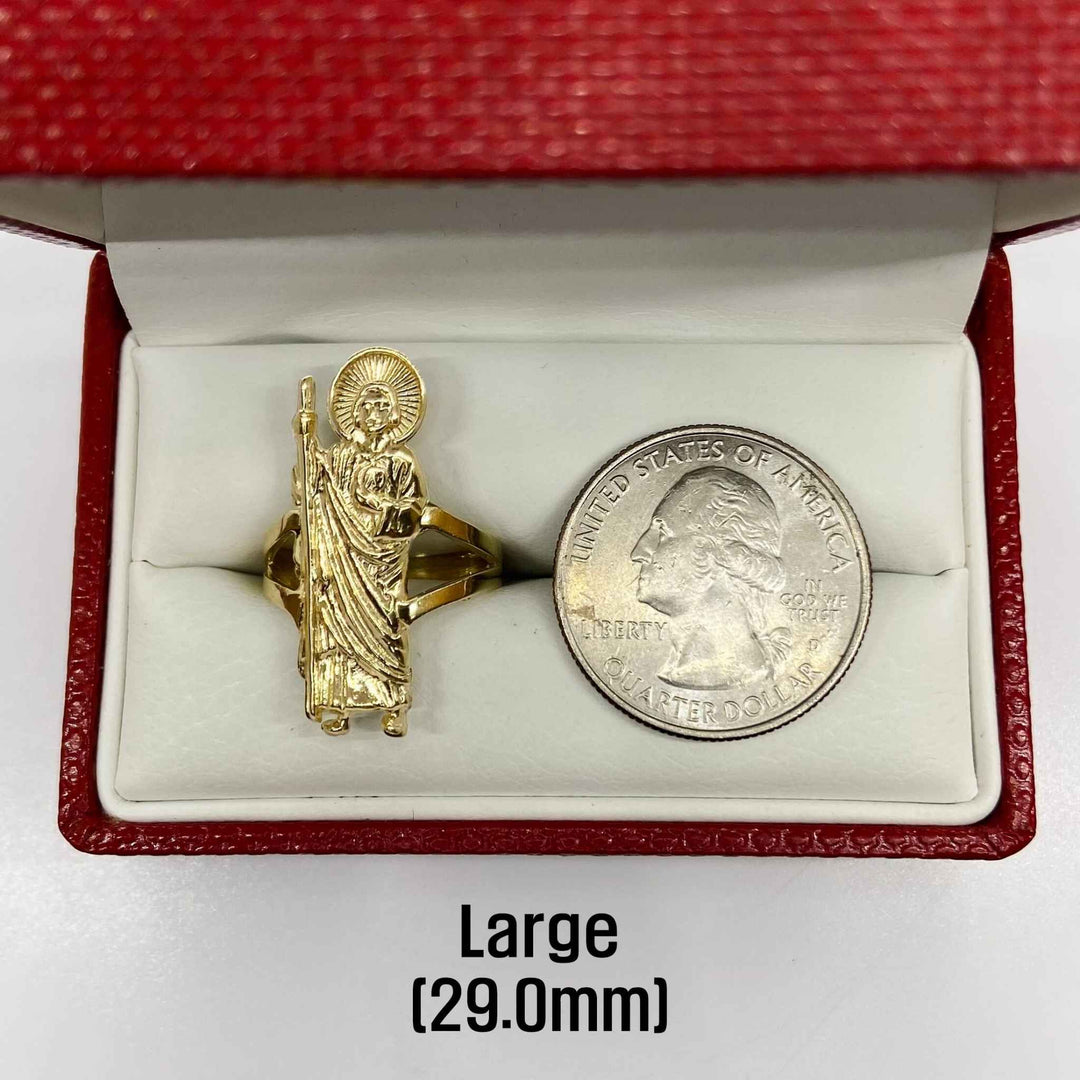 14k Gold ring with religious design next to a quarter in a red box