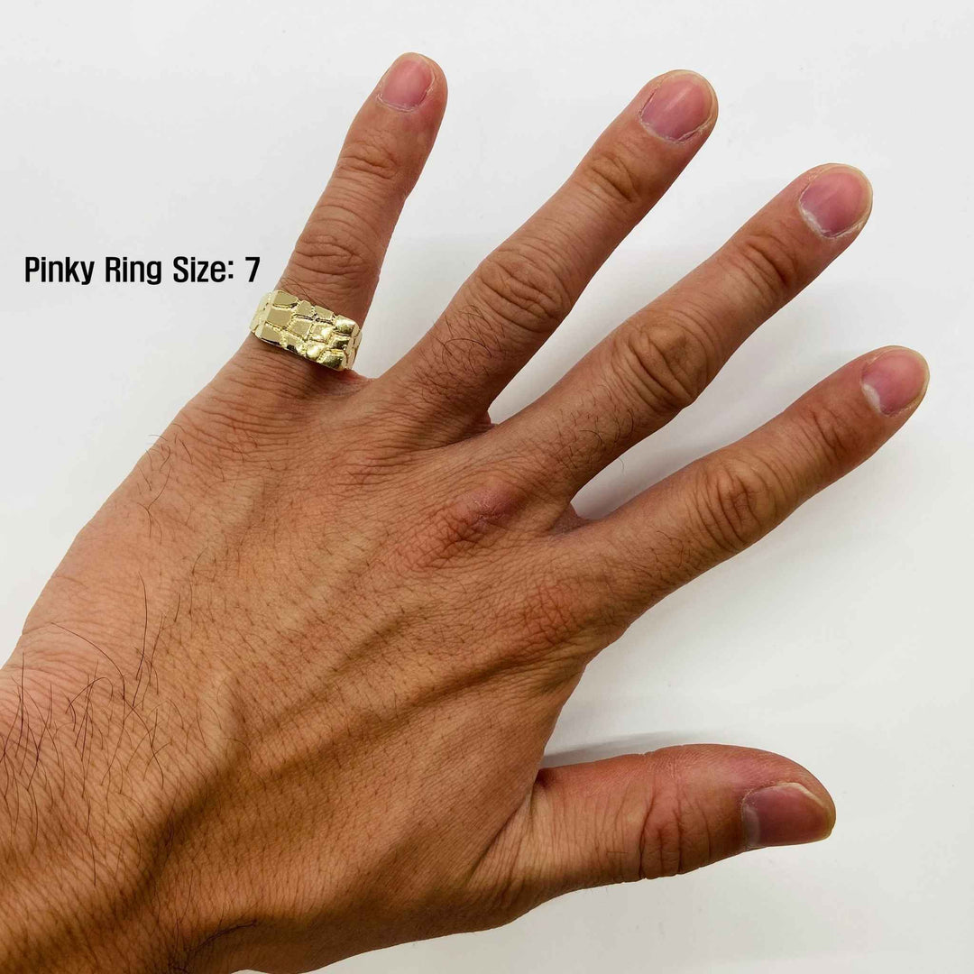 Hand wearing a 14k gold nugget ring with 'Pinky Ring Size  7' text 