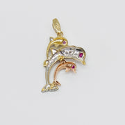 Back view of a 14k tri-color gold trio dolphin pendant displaying textured mesh structure.