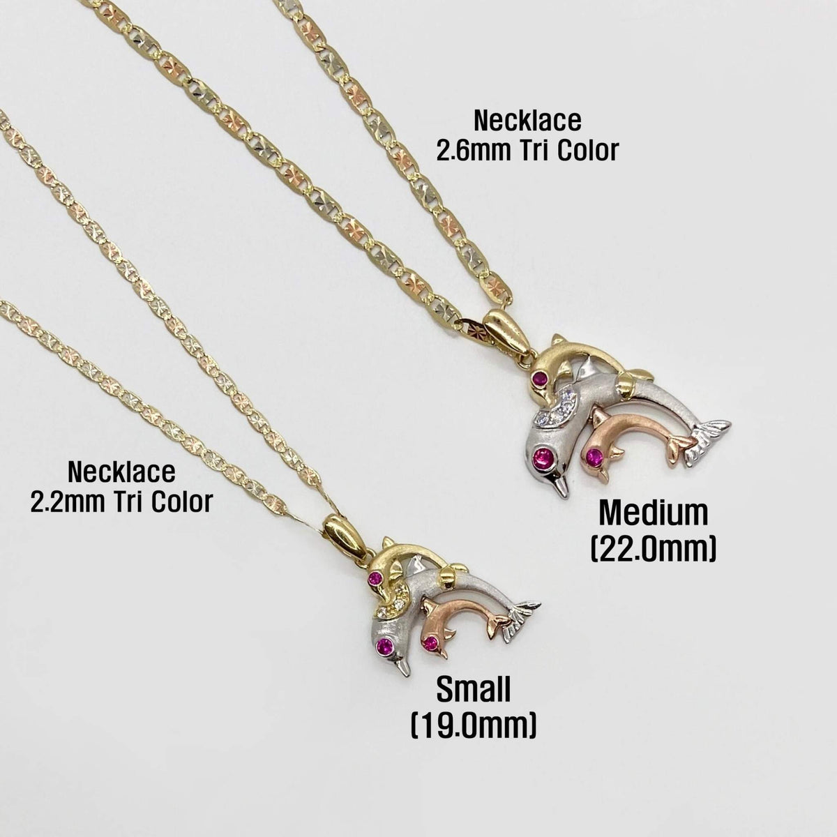 Small and medium 14k tri-color gold trio dolphin necklaces labeled with 2.2mm and 2.6mm chain options.