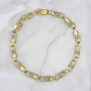 14k gold vintage Turkish link bracelet featuring ornate patterned links and lobster clasp.