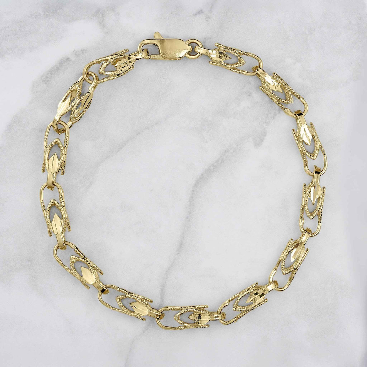 14k gold vintage Turkish link bracelet featuring ornate patterned links and lobster clasp.