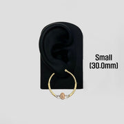 30.0mm 14k gold Virgin Mary hoop earring displayed on a black mannequin ear stand.