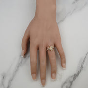 Gold turtle fancy ring with stone accents displayed on ring finger.
