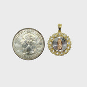 Size comparison of a 14k gold tri-color Virgin Mary round medallion pendant next to a US quarter.