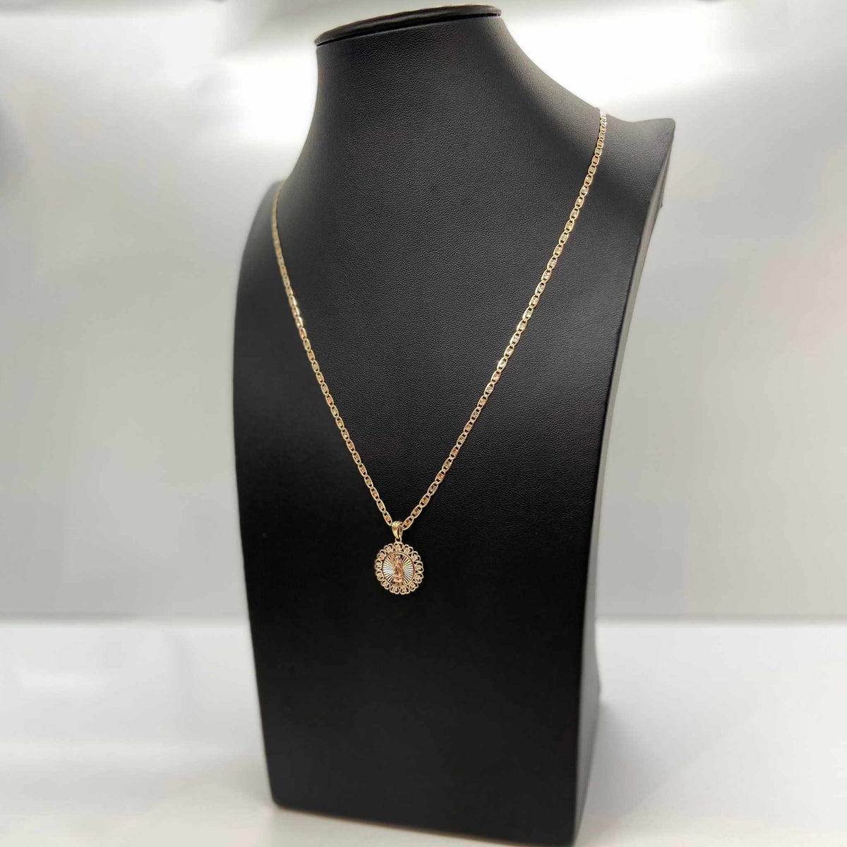 14k gold tri-color Virgin Mary round medallion pendant necklace displayed on a black mannequin bust.