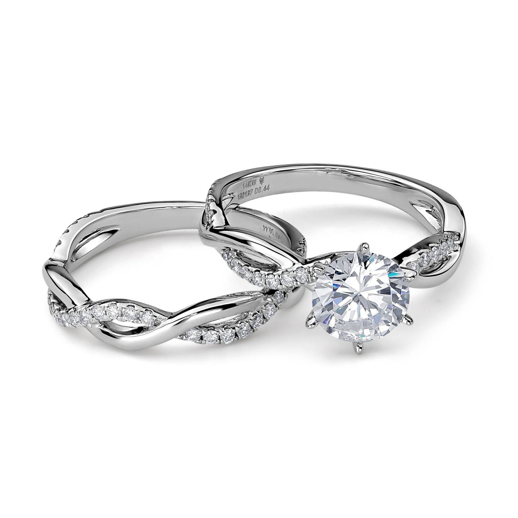 Two-piece white gold wedding ring set with a round diamond.