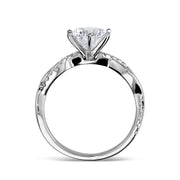 Side profile view of a white gold engagement ring with a twisted band.