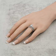 14k white gold lab-grown diamond ring set with a twisted band worn on a hand.