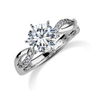 14k white gold engagement ring featuring a large round diamond and twisted band.
