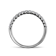 Single white gold pavé diamond wedding ring on a white background.
