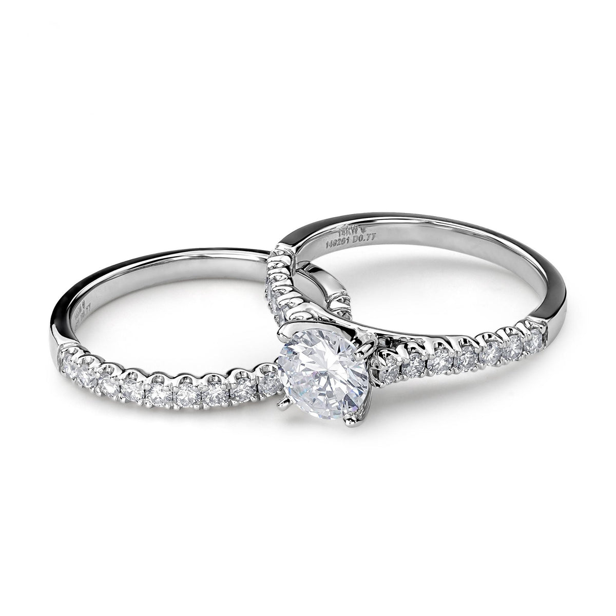 14k white gold round lab-grown diamond engagement ring and matching pavé wedding band.