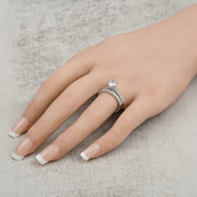 14k white gold round lab-grown diamond ring set modeled on a hand.