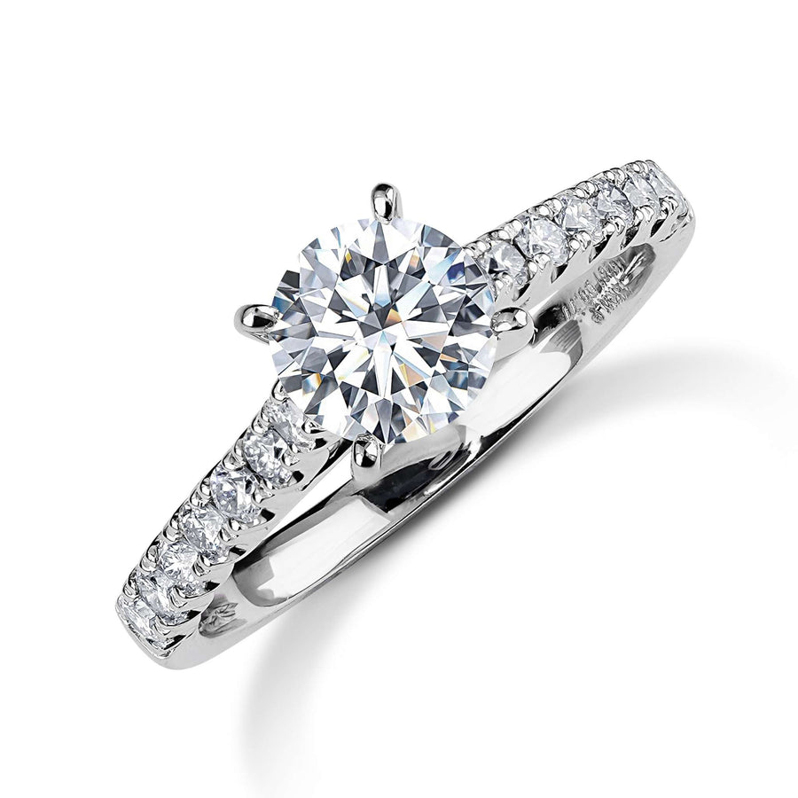 Solitaire round lab-grown diamond ring with diamond-set white gold band.