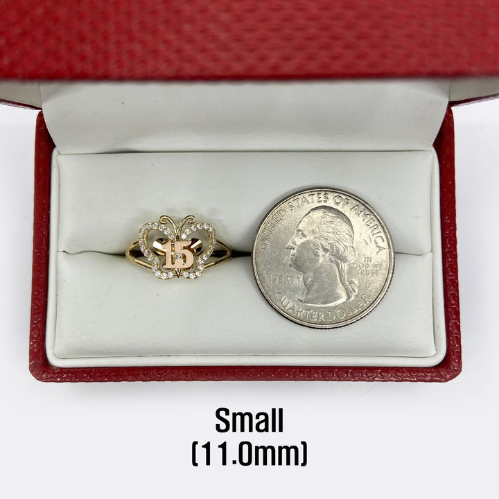 10k - 14k Butterfly shaped  Quinceanera ring next to a quarter for scale.