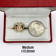10k - 14k Gold Quinceanera ring with 15 symbol next to a U.S. quarter.