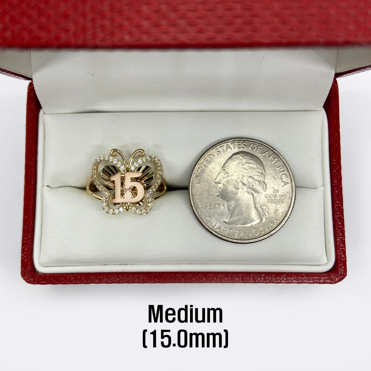 10k - 14k Gold Quinceanera ring with 15 symbol next to a U.S. quarter.