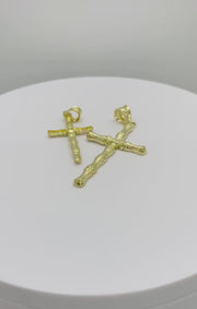 Video showcase of two 10k yellow gold textured bamboo slim cross pendant charms.
