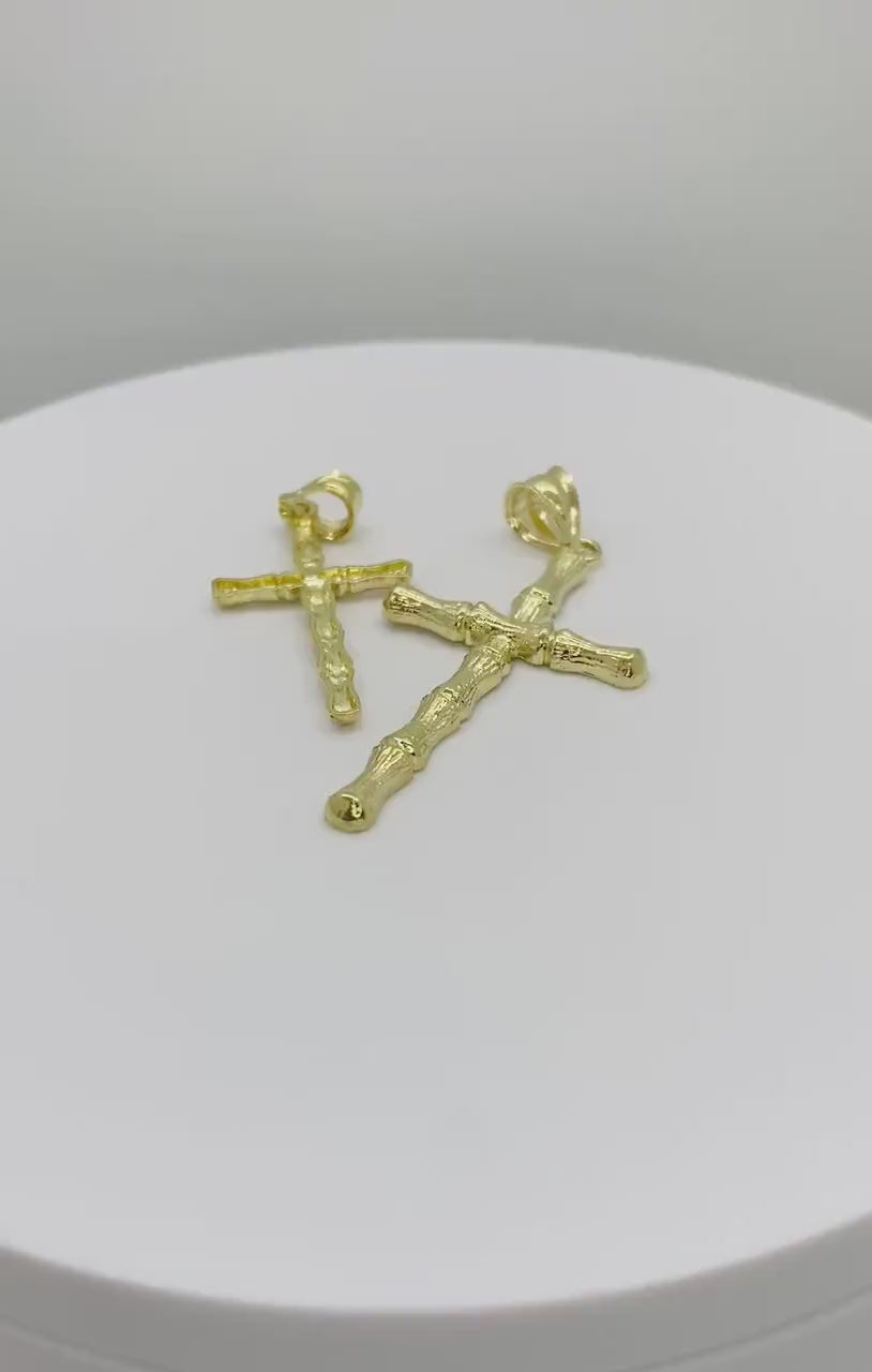 Video showcase of two 10k yellow gold textured bamboo slim cross pendant charms.