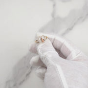 Video showcasing a gold Virgin Mary heart ring with sparkling cubic zirconia.