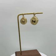 Video showcase of two 10k yellow gold 3D world globe pendant charms.