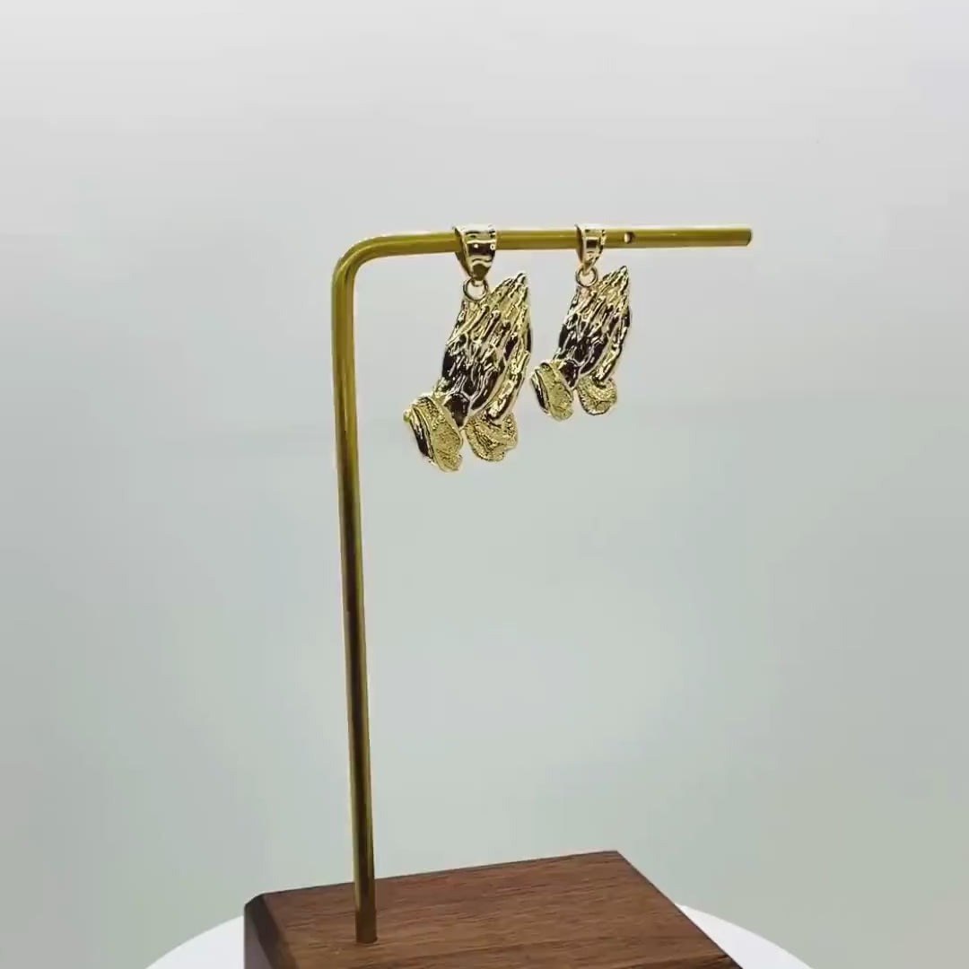 Video showcase of two 10k solid yellow gold praying hands pendant charms.